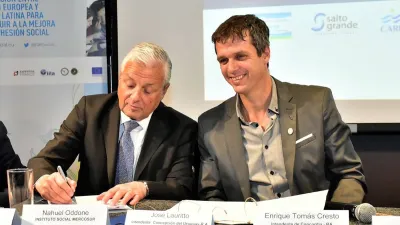 José Lauritto y Enrique Cresto firmando acuerdo