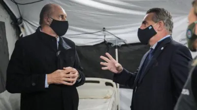 Omar Perotti con Agustín Rossi